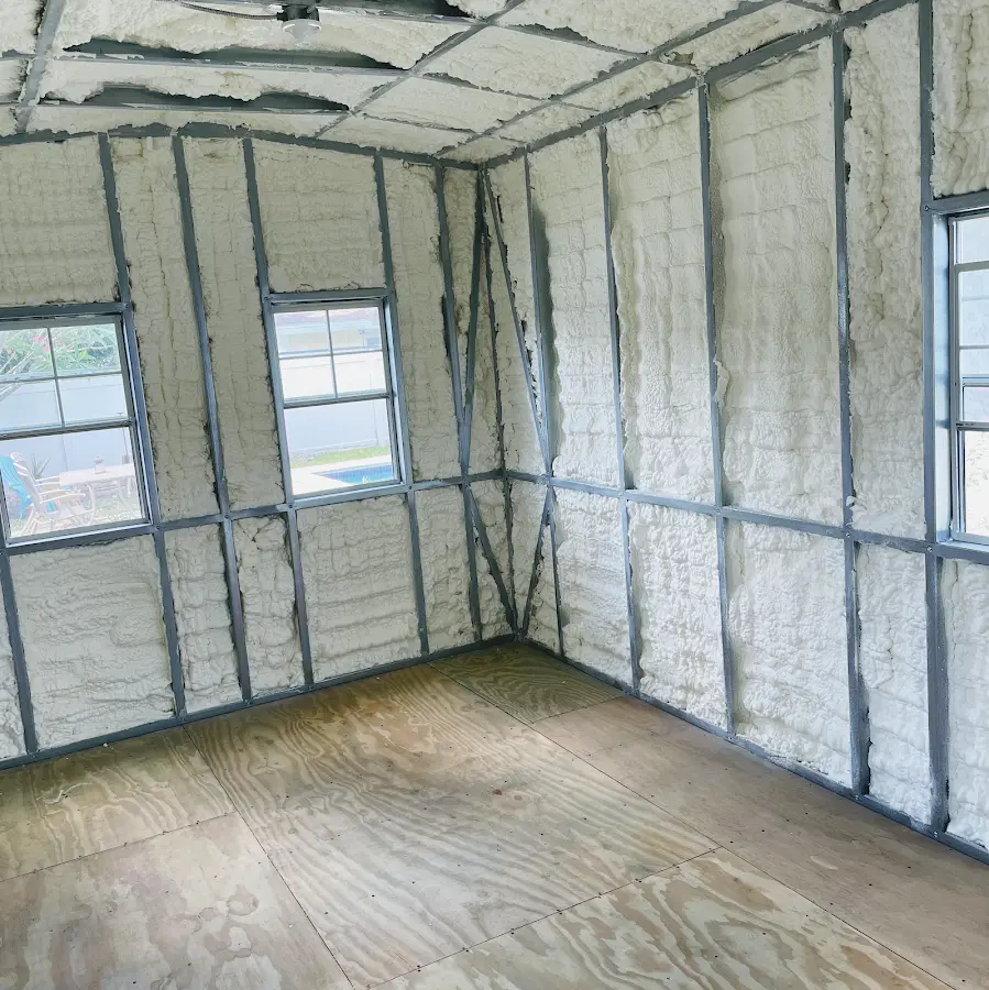 Closed-cell spray foam insulation applied to wall cavities in a residential project in Osceola